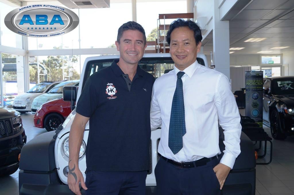 Picture of Loc Tran with Harry Kewell - promotion for Jeep Australia